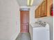 A view of the laundry room with a washer and dryer at 108 W Ivyglen St, Mesa, AZ 85201