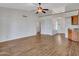 Bright living room featuring wood-look floors, a vaulted ceiling, and an open layout at 108 W Ivyglen St, Mesa, AZ 85201
