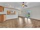 Open-concept living area with wood-look floors, large windows, and access to the backyard at 108 W Ivyglen St, Mesa, AZ 85201