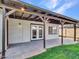 Covered patio with tiled flooring and ample space for seating at 108 W Ivyglen St, Mesa, AZ 85201