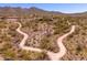 An aerial view of walking paths meandering through a desert community at 11267 E Beck Ln, Scottsdale, AZ 85255