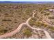 A serene walking path winds through the expansive desert landscape of this community at 11267 E Beck Ln, Scottsdale, AZ 85255