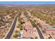 Beautiful aerial view displaying the homes and landscaping in a well-maintained community with mature trees at 11267 E Beck Ln, Scottsdale, AZ 85255