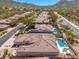 Aerial view of a community with stunning pools and well-maintained landscaping, perfect for luxury living at 11267 E Beck Ln, Scottsdale, AZ 85255
