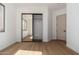 Neutral toned bedroom featuring a sliding closet door and a window at 11267 E Beck Ln, Scottsdale, AZ 85255