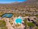 The community features a sparkling pool, jacuzzi, and tennis courts, set against a picturesque desert backdrop at 11267 E Beck Ln, Scottsdale, AZ 85255
