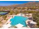A stunning community pool and hot tub area surrounded by desert landscape, creating a serene oasis at 11267 E Beck Ln, Scottsdale, AZ 85255