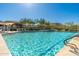 Sparkling community pool with ample lounge seating and shade, perfect for relaxation and recreation at 11267 E Beck Ln, Scottsdale, AZ 85255