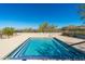 Relaxing community spa with beautiful blue tiled trim, offering a serene escape with scenic desert views at 11267 E Beck Ln, Scottsdale, AZ 85255