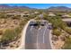 Gated entry of desert community with scenic views and native landscaping at 11267 E Beck Ln, Scottsdale, AZ 85255