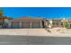 Inviting home with a three-car garage, desert landscaping and a well-maintained facade at 11267 E Beck Ln, Scottsdale, AZ 85255