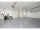 Spacious three car garage with gray epoxy flooring and ample space at 11267 E Beck Ln, Scottsdale, AZ 85255