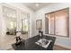 Stylish office with a modern desk, natural light, and easy access to other parts of the home at 11267 E Beck Ln, Scottsdale, AZ 85255