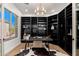 Well-appointed home office with custom built-ins, modern lighting, and a serene workspace environment at 11267 E Beck Ln, Scottsdale, AZ 85255