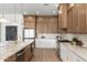 Modern kitchen island featuring stainless steel appliances, updated countertops and finishes, and stylish decor at 11267 E Beck Ln, Scottsdale, AZ 85255