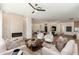 Open living space with a fireplace, an open floorplan, and an inviting atmosphere for relaxing and entertaining at 11267 E Beck Ln, Scottsdale, AZ 85255