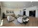 Bright living room with modern decor, including stylish furnishings and light hardwood floors at 11267 E Beck Ln, Scottsdale, AZ 85255