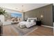 Relaxing main bedroom with a sitting area, stylish lighting, and large windows for natural light at 11267 E Beck Ln, Scottsdale, AZ 85255