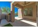 Covered outdoor patio with kitchen and outdoor grill, overlooking a sparkling swimming pool at 11267 E Beck Ln, Scottsdale, AZ 85255