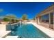 A refreshing pool with tiled water features adjacent to the covered patio of the home at 11267 E Beck Ln, Scottsdale, AZ 85255