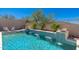 Sparkling pool with water features, surrounded by lush landscaping and comfortable seating areas at 11267 E Beck Ln, Scottsdale, AZ 85255