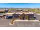 Retail center with exterior view of a Dunkin Donuts surrounded by ample parking with a desert landscape view at 11267 E Beck Ln, Scottsdale, AZ 85255