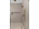 Modern shower with a built-in niche, rainfall shower head and bronze fixtures at 11267 E Beck Ln, Scottsdale, AZ 85255