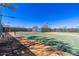 Scenic community tennis courts featuring new netting, lights, and clear court markings for tennis enthusiasts at 11267 E Beck Ln, Scottsdale, AZ 85255