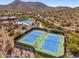 Community tennis courts and pool with desert views providing plenty of recreation and relaxation opportunities at 11267 E Beck Ln, Scottsdale, AZ 85255