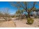 An inviting walking path leads to a pergola in this desert community at 11267 E Beck Ln, Scottsdale, AZ 85255