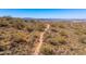 A dirt walking path meanders through the desert landscape with distant mountains at 11267 E Beck Ln, Scottsdale, AZ 85255