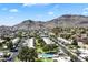 Aerial view of a community featuring mature trees, sidewalks and stunning mountain views at 1173 E Beryl Ave, Phoenix, AZ 85020