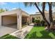 Charming home with an attached carport, well-maintained lawn, and mature trees at 1173 E Beryl Ave, Phoenix, AZ 85020