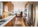 Open-concept kitchen showcasing stainless steel appliances and views into the adjacent dining and living areas at 1173 E Beryl Ave, Phoenix, AZ 85020