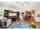 Open-concept living space flows into the dining area, complete with a large screen TV at 1173 E Beryl Ave, Phoenix, AZ 85020