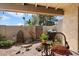 Cozy covered patio area featuring beautiful brick tiles and ample space for outdoor seating and grilling at 1173 E Beryl Ave, Phoenix, AZ 85020