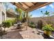 Charming outdoor patio offers a seating area, desert landscaping and privacy, great for relaxing or entertaining at 1173 E Beryl Ave, Phoenix, AZ 85020