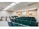 Spacious auditorium with a projector and screen, ideal for presentations and film screenings at 1202 Leisure World --, Mesa, AZ 85206