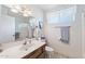 Bright bathroom featuring a vanity, toilet, and shower with modern fixtures and stylish design at 1202 Leisure World --, Mesa, AZ 85206