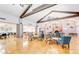 Spacious clubhouse featuring a large meeting area with exposed beams, chandeliers, and stone fireplace at 1202 Leisure World --, Mesa, AZ 85206