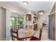 Open floor plan in kitchen and dining space with access to outdoor patio area at 1202 Leisure World --, Mesa, AZ 85206