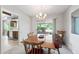 Traditional dining room with bright lighting, table and chairs, and views to the yard at 1202 Leisure World --, Mesa, AZ 85206