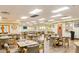 Bright dining area with tables, chairs, and neutral decor, perfect for community gatherings and meals at 1202 Leisure World --, Mesa, AZ 85206