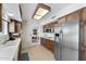 Bright kitchen featuring wood cabinets, stainless steel appliances, and ample counter space for meal prep at 1202 Leisure World --, Mesa, AZ 85206