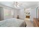 Main bedroom featuring a ceiling fan, closet, and adjacent bathroom at 1202 Leisure World --, Mesa, AZ 85206