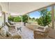 Relaxing covered patio with comfortable seating, overlooking scenic golf course views at 1202 Leisure World --, Mesa, AZ 85206