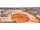 Expansive aerial view of equestrian center showcasing arenas, stables, and open spaces at 1280 W Blue Ridge Dr, San Tan Valley, AZ 85140