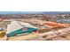 Wide aerial shot of equestrian center and auto arena surrounded by homes and landscaped areas at 1280 W Blue Ridge Dr, San Tan Valley, AZ 85140
