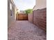 Spacious backyard with gravel and tall fencing for added privacy and security for outdoor enjoyment at 1280 W Blue Ridge Dr, San Tan Valley, AZ 85140