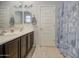 Bathroom features a double vanity with modern faucets and decorative nautical decor above the mirrors at 1280 W Blue Ridge Dr, San Tan Valley, AZ 85140